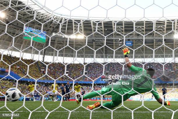 Shinji Kagawa of Japan scores his team's first goal past David Ospina of Colombia during the 2018 FIFA World Cup Russia group H match between...