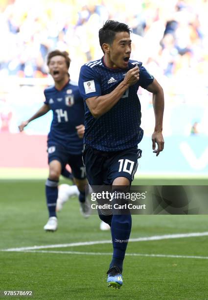 Shinji Kagawa of Japan celebrates after scoring a penalty for his team's first goal during the 2018 FIFA World Cup Russia group H match between...