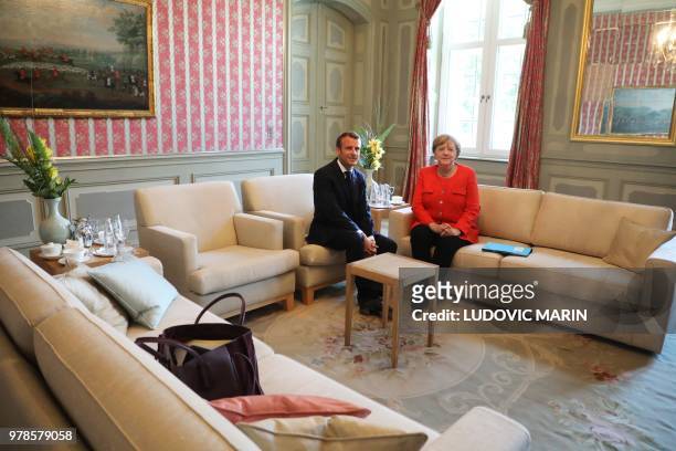 German Chancellor Angela Merkel and French President Emmanuel Macron pose before holding bilateral talks on June 19 at the Meseberg Palace, north of...