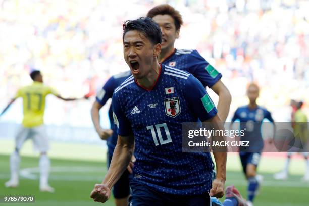 Japan's midfielder Shinji Kagawa celebrates after scoring a penalty during the Russia 2018 World Cup Group H football match between Colombia and...