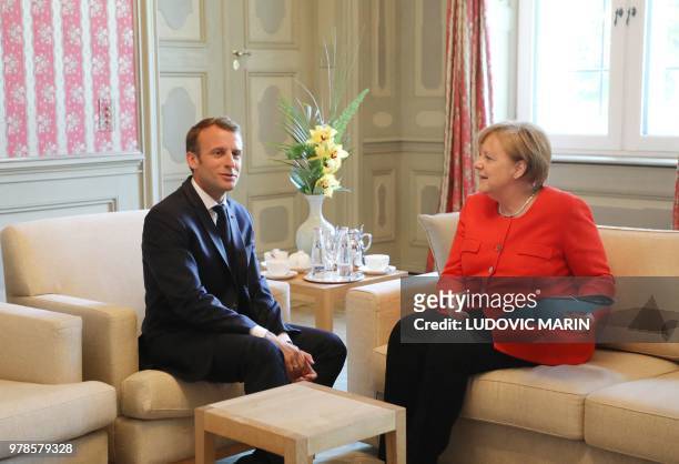 German Chancellor Angela Merkel and French President Emmanuel Macron hold bilateral talks on June 19 at the Meseberg Palace, north of Berlin, during...