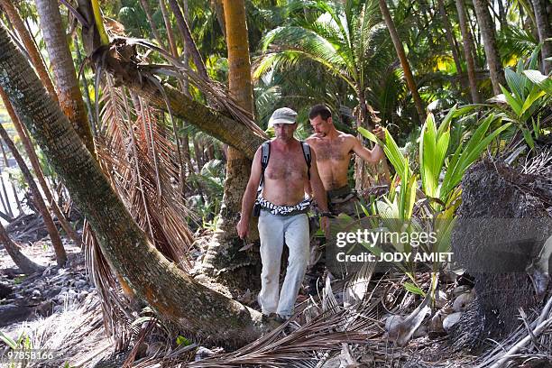 Scientist of the Terre-Ocean mission, French geologist Eric Gilli walks, on February 13 on the Devil's Island in the Caribbean Sea off French Guiana,...