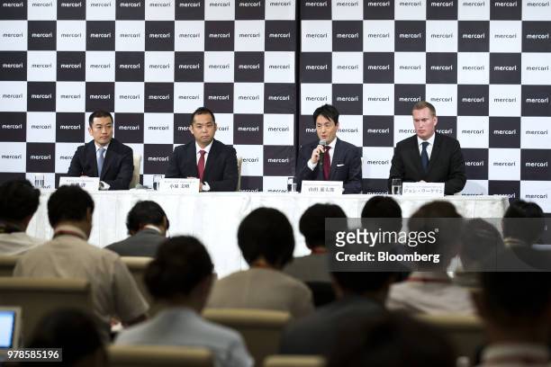 Shintaro Yamada, chief executive officer of Mercari Inc., second from right, speaks as Kei Nagasawa, chief financial officer of Mercari Inc., left,...