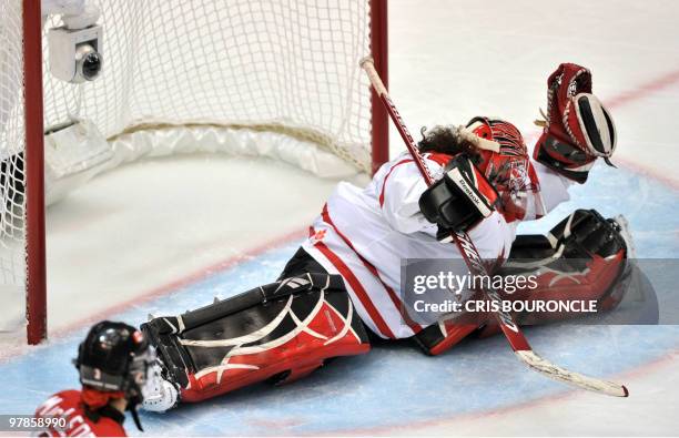 Canadian goalkeeper Shannon Szabados blocks the bet during the Women's Gold Medal Hockey game between USA and Canada at the Canada Hockey Place...