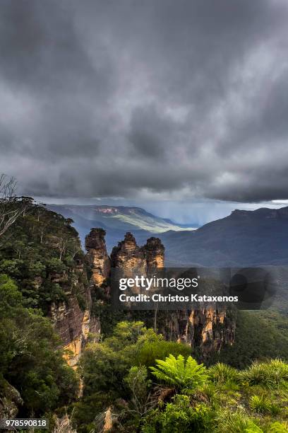 moody sky over rocks, sydney, australia - three sisters rock formation australia stock pictures, royalty-free photos & images