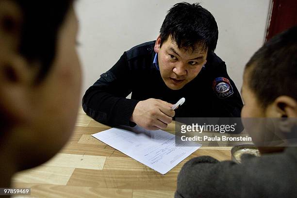 Mongolian street children lectured as they get registered at a child detention center March 11, 2010 in Ulaan Baatar, Mongolia. The police picked up...