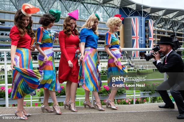 Camera man films The Tootsie Rollers as they display their dresses and hats on day 1 of Royal Ascot at Ascot Racecourse on June 19, 2018 in Ascot,...