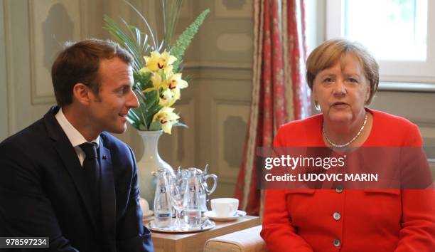 German Chancellor Angela Merkel and French President Emmanuel Macron hold bilateral talks on June 19 at the Meseberg Palace, north of Berlin, during...