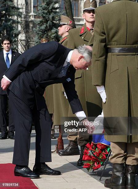 Britain's Prince Charles lays a wreath in front of the parliament building at Kossuth square of Budapest on March 19, 2010 during his visit at the...