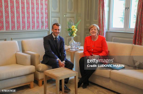 German Chancellor Angela Merkel and French President Emmanuel Macron hold bilateral talks on June 19 at the Meseberg Palace, north of Berlin, during...