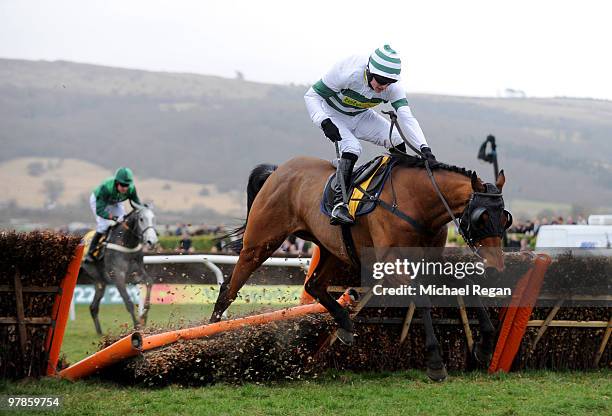 Tom O'Brien on Barizan makes a mistake on the last fence and lets in Barry Geraghty on Soldatino to run on to victory in The JCB Triumph Hurdle Race...