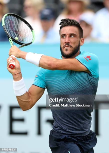 Damir Dzumhur of Bosnia plays a backhand during his match against Grigor Dimitrov of Bulgaria on Day Two of the Fever-Tree Championships at Queens...