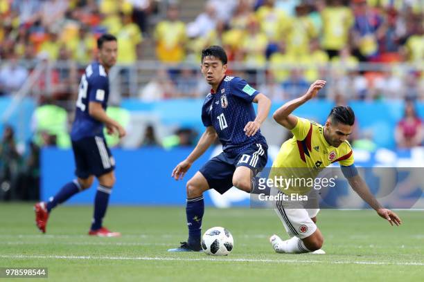 Radamel Falcao is fouked by Shinji Kagawa of Japan during the 2018 FIFA World Cup Russia group H match between Colombia and Japan at Mordovia Arena...