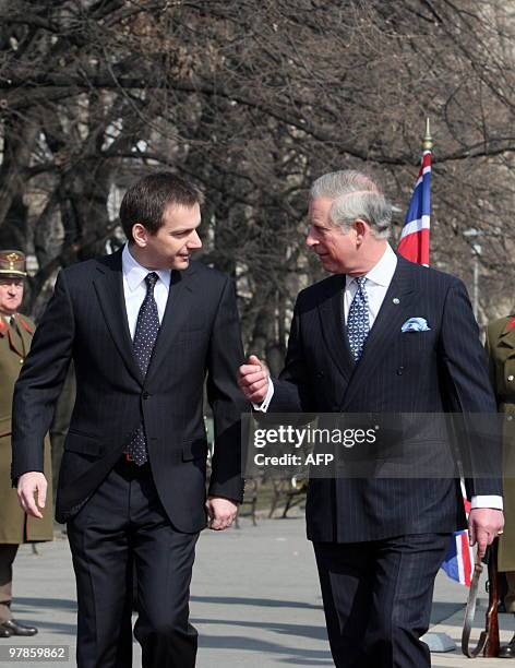 Britain's Prince Charles walks with Hungarian Prime Minister Gordon Bajnai in front of the parliament building at Kossuth square in Budapest on March...