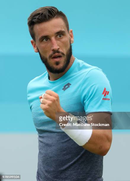 Damir Dzumhur of Bosnia celebrates winning a point during his match against Grigor Dimitrov of Bulgaria on Day Two of the Fever-Tree Championships at...