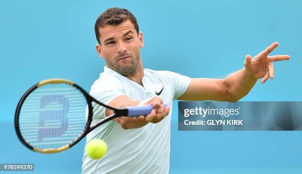 Bulgaria's Grigor Dimitrov returns against Bosnia and Herzegovina's Damir Dzumhur during their first round men's singles match at the ATP Queen's...