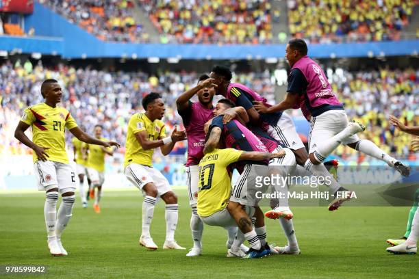 Juan Quintero of Colombia celebrates with teammates after scoring his team's first goal during the 2018 FIFA World Cup Russia group H match between...