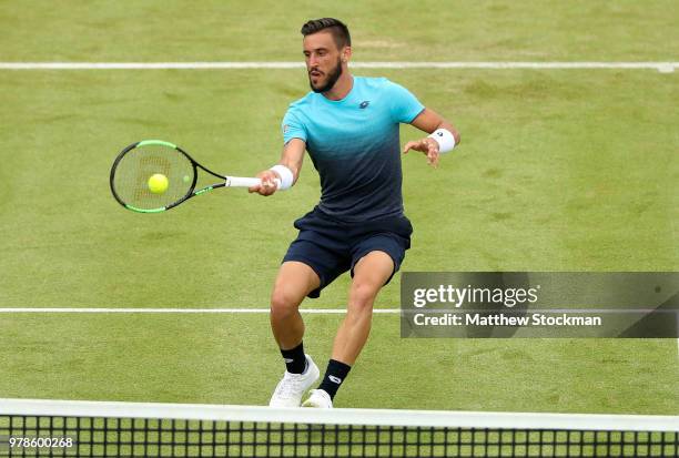 Damir Dzumhur of Bosnia plays a forehand during his match against Grigor Dimitrov of Bulgaria on Day Two of the Fever-Tree Championships at Queens...