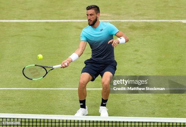 Damir Dzumhur of Bosnia plays a forehand during his match against Grigor Dimitrov of Bulgaria on Day Two of the Fever-Tree Championships at Queens...