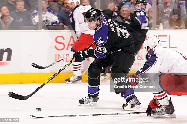 Fredrik Modin of the Los Angeles Kings skates with the puck against Marc Methot of the Columbus Blue Jackets on March 8, 2010 at Staples Center in...