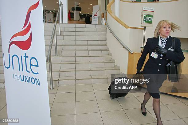 British Airways cabin crew leave Sandown Park racecourse in Surrey, southern England, after a Unite Union meeting, on March 19, 2010. Talks aimed at...