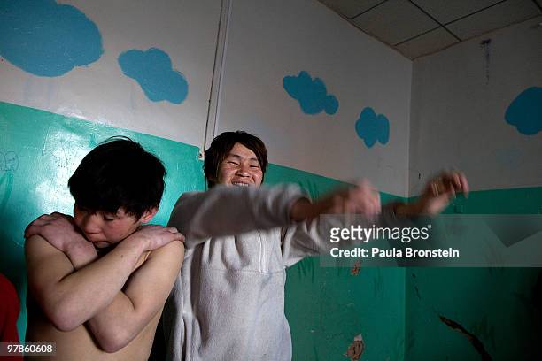 Mongolian street kids wait exercise at the child detention center March 11, 2010 in Ulaan Baatar, Mongolia. The police picked up a dozen boys to get...