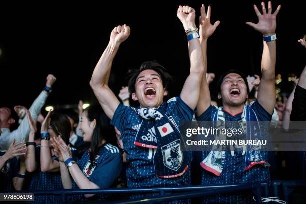 Japanese supporters celebrates Japanese team's goal in the penalty kick while watching Japan's first World Cup match in the Group H against Colombia...