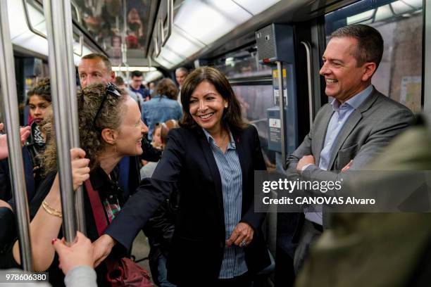 The mayor of Paris Anne Hidalgo with Colombe Brossel and Gilles Alayrac are photographed for Paris Match in the subway on May 24, 2018 in Paris,...