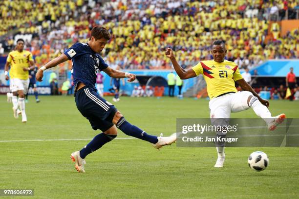 Yuya Osako of Japan shoots at goal pastJose Izquierdo of Colombia during the 2018 FIFA World Cup Russia group H match between Colombia and Japan at...