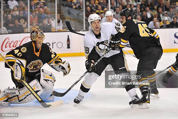 Tyler Kennedy of the Pittsburgh Penguins watches the play against Tuukka Rask and Mark Stuart of the Boston Bruins at the TD Garden on March 18, 2010...