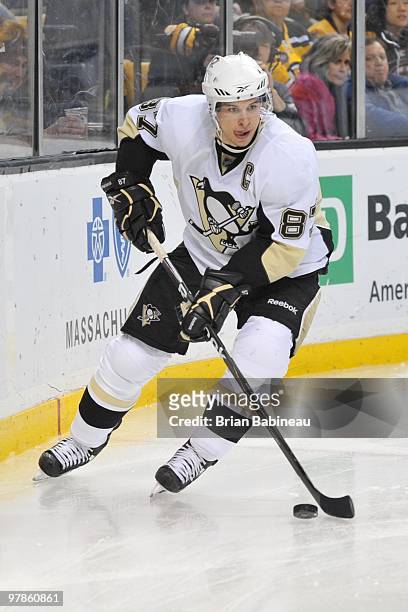 Sidney Crosby of the Pittsburgh Penguins skates with the puck against the Boston Bruins at the TD Garden on March 18, 2010 in Boston, Massachusetts.