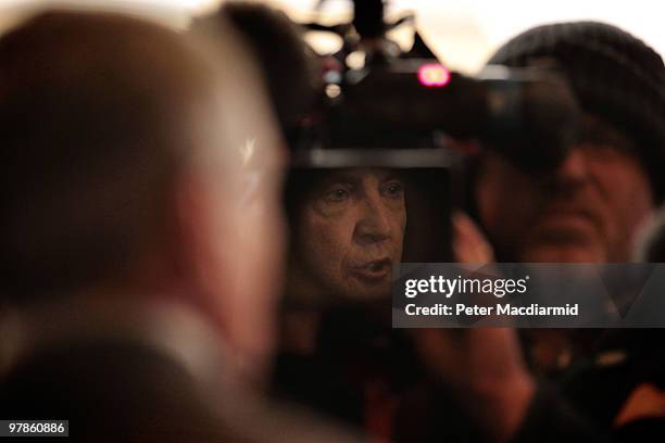 The Unite Union joint general secretary Tony Woodley is reflected in a television camera lens as he talks to reporters at the Trades Union Congress...