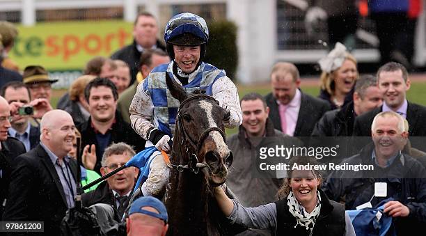 Andrew Lynch celebrates after riding Bertie's Dream to victory in the Albert Bartlett Novices' Hurdle on Day Four of the Cheltenham Festival on March...