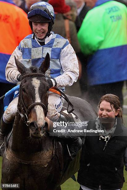 Andrew Lynch celebrates after riding Bertie's Dream to victory in the Albert Bartlett Novices' Hurdle on Day Four of the Cheltenham Festival on March...