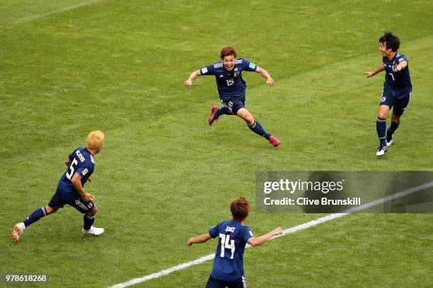 Yuya Osako of Japan celebrates scoring the 2nd Japan goal to make it 2-1 with Yuto Nagatomo, Gaku Shibasaki and Takashi Inui of Japan during the 2018...