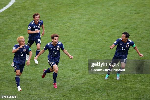 Yuya Osako of Japan celebrates scoring the 2nd Japan goal to make it 2-1 with Yuto Nagatomo, Gaku Shibasaki and Takashi Inui of Japan during the 2018...