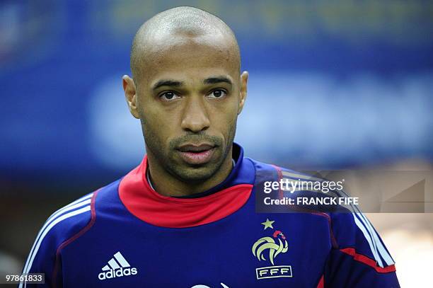 French captain and attacker Thierry Henry warms up prior to a friendly international football match against Spain at the stade de France in Paris on...