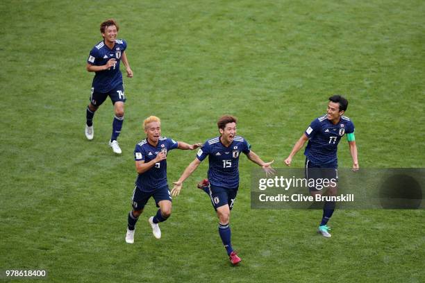 Yuya Osako of Japan celebrates scoring the 2nd Japan goal to make it 2-1 with Yuto Nagatomo, Gaku Shibasaki and Takashi Inui of Japan during the 2018...