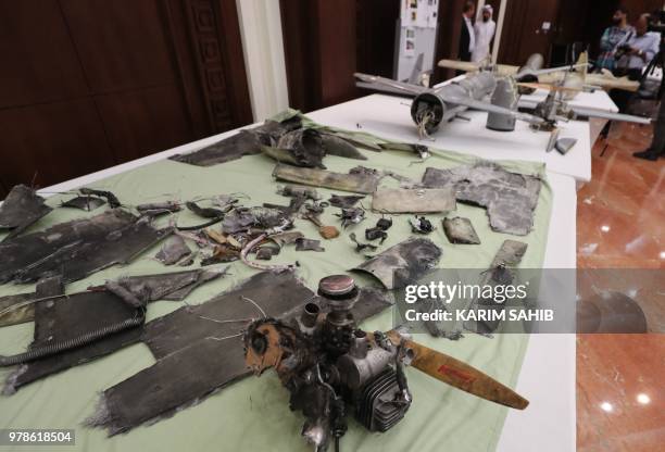 Picture taken on June 19, 2018 shows debris of Iranian-made Ababil drones displayed Abu Dhabi, which the Emirati armed forces say were used by Houthi...