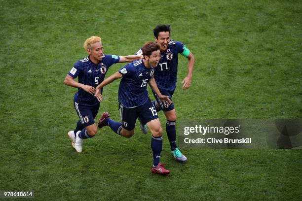 Yuya Osako of Japan celebrates scoring the 2nd Japan goal to make it 2-1 with Yuto Nagatomo and Makoto Hasebe of Japan during the 2018 FIFA World Cup...