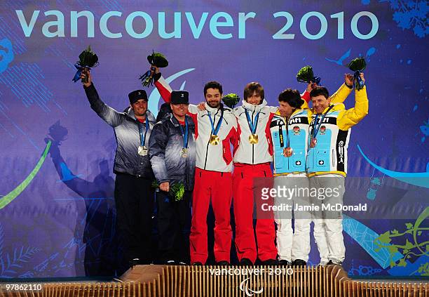 Silver medalist Mark Bathum of USA and guide Storey Slater , gold medalist Jon Santacana Maiztegui of Spain and guide Miguel Galindo Garces and...