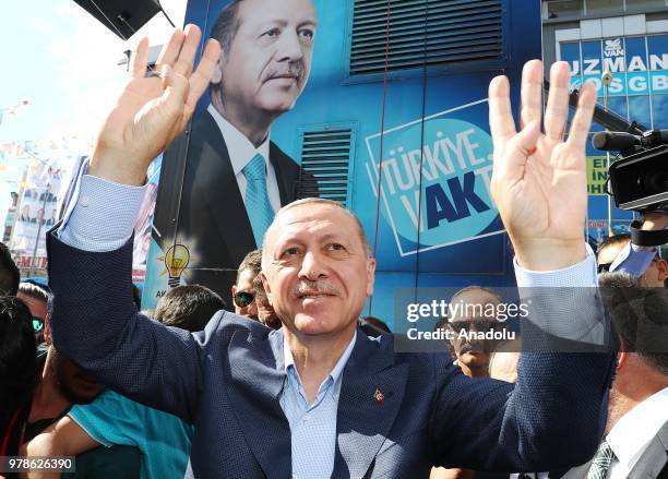 Turkish President and the leader of the Justice and Development Party Recep Tayyip Erdogan greets the crowd as he attends Turkey's ruling AK Partys...