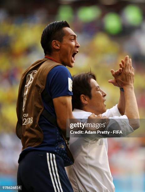 Akira Nishino, Manager of Japan celebrates with Tomoaki Makino of Japan following their sides victory in the 2018 FIFA World Cup Russia group H match...