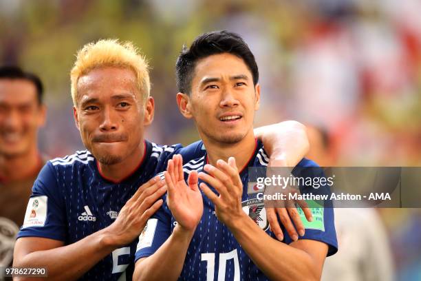 Shinji Kagawa and Yuto Nagatomo of Japan celebrate at the end of the 2018 FIFA World Cup Russia group H match between Colombia and Japan at Mordovia...