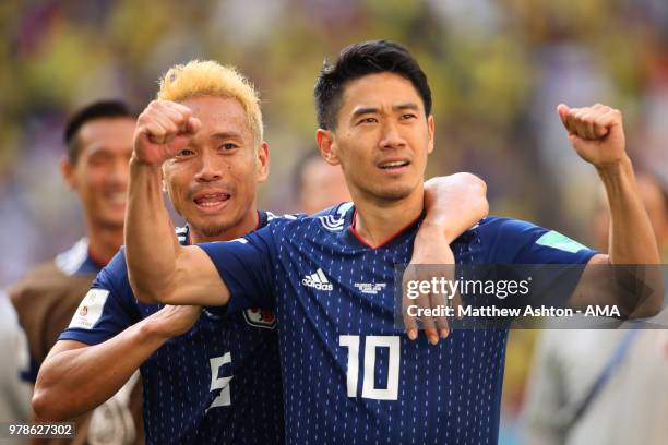 Shinji Kagawa and Yuto Nagatomo of Japan celebrate at the end of the 2018 FIFA World Cup Russia group H match between Colombia and Japan at Mordovia...