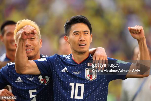 Shinji Kagawa and Yuto Nagatomo of Japan celebrate at the end of the 2018 FIFA World Cup Russia group H match between Colombia and Japan at Mordovia...