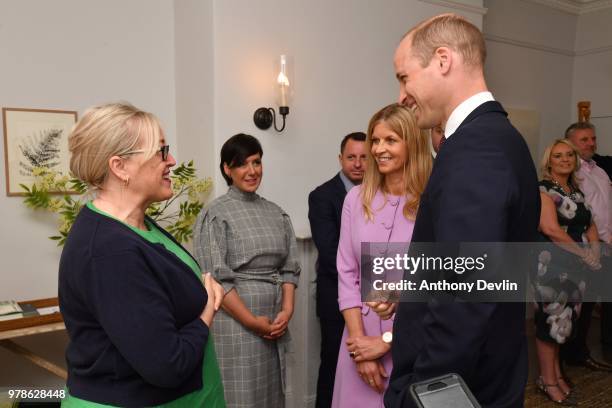 The Duke of Cambridge speaks with centre manager Jane Boland during a visit to James' Place in Liverpool on June 19, 2018 in Liverpool, England....