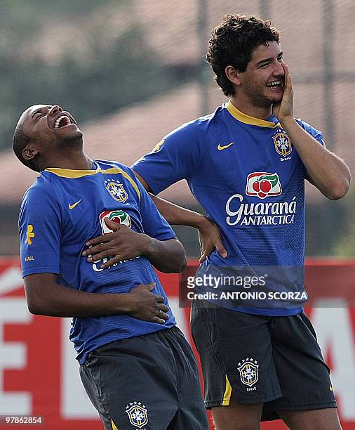 Brazilian footballers Robinho and Alexandre Pato laugh during a training session of the national team on June 11 in Teresopolis, Brazil. Brazil will...