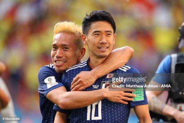 Shinji Kagawa and Yuto Nagatomo of Japan celebrate at the end of the 2018 FIFA World Cup Russia group H match between Colombia and Japan at Mordovia...