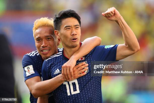 Shinji Kagawa and Yuto Nagatomo of Japan celebrate at the end of the 2018 FIFA World Cup Russia group H match between Colombia and Japan at Mordovia...